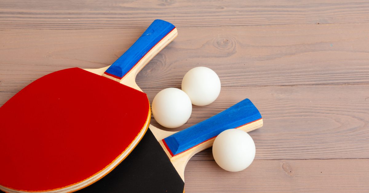 Ping pong equipment on wooden table close up